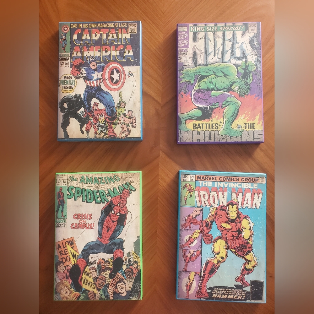 The prints of comic book covers on a wooden plank